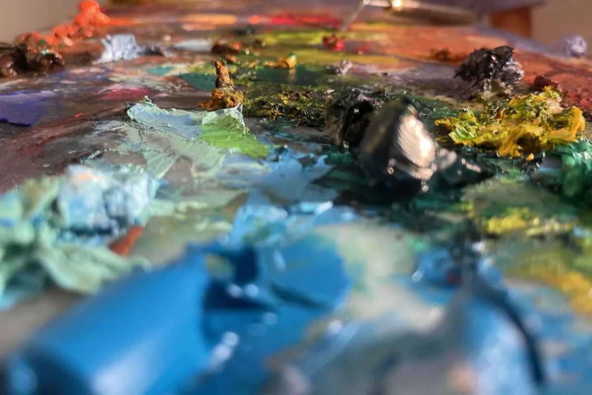 Close-up of professional oil paints mixed on an artist palette